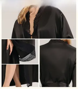 Detailed close-up of luxurious black satin nightdress with elegant lace trim highlights