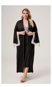 Detailed close-up of white floral lace cuffs on black satin long sleeve robe for women