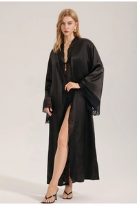 Detailed close-up of luxurious black satin robe with intricate floral lace trim for women