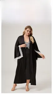 Detailed view of women's black satin robe with delicate white lace trim on the sleeves