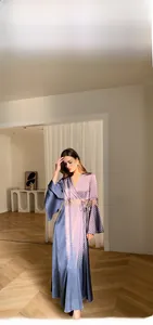 Detail of elegant satin bathrobe with lace waist trim and wide flare sleeves in grey-purple