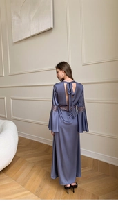 Detailed back view of satin nightgown with lace trim, bell sleeves and bow tie design