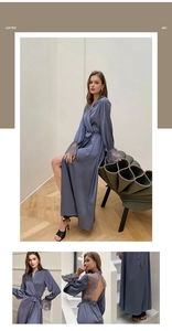 Detail view of grey blue satin robe showing elegant lace patchwork and open back design