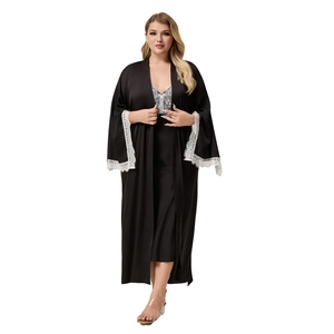 Women's black satin sleepwear set with long sleeves and elegant white lace trim detail
