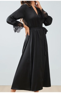 Detailed view of elegant black satin sleepwear robe featuring intricate lace sleeves