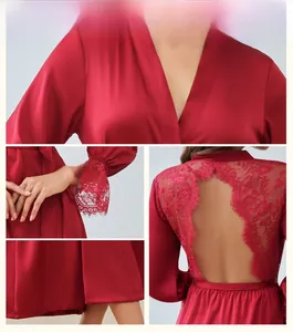 Detail view of red satin nightgown featuring intricate floral lace on cuffs and back