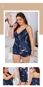 Detail view of navy blue satin plus size pajama set with lace trim and feather print