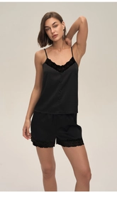Close-up of black satin camisole with delicate lace trim and decorative buttons