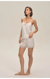 Detail of ivory satin pajama set with eyelash lace trim and buttons on camisole top