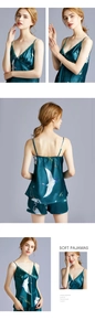 Detail of silk-like V-neck camisole pajamas featuring white crane and plant prints