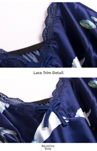 Close-up of lace trim detailing and bow on dark blue satin floral print sleepwear