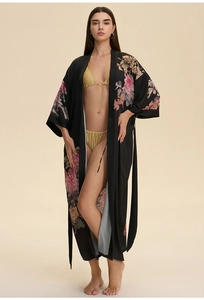Detail of a floral satin long kimono robe with black fabric and peony prints