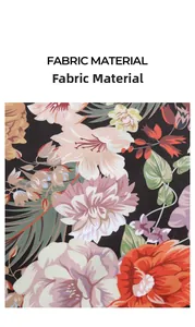 Detailed view of satin fabric featuring a large floral pattern in pink and orange tones