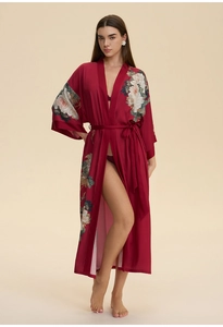 Detail of dark red floral satin robe showing elegant flower prints and kimono-style sleeves