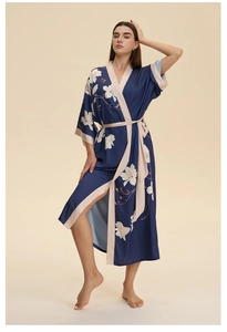 Detail of silk satin navy floral robe featuring champagne contrast piping and long sleeves