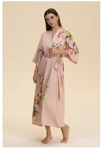 Detail of pink floral satin robe with elegant kimono collar and matching waist tie