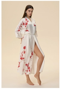 Detailed full view of white satin robe featuring red plum blossom print and waist tie