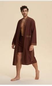 Detail view of men's dark robe set showing vintage patterned trim and soft woven fabric