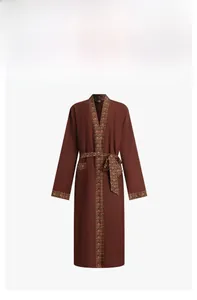 Detail of terracotta robe with vintage paisley patterns on cuffs and waist belt