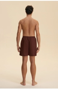 Rear view of men's loose dark brown loungewear shorts with elastic waist and straight cut