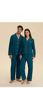 Deep teal long sleeve couple pajama sets with white piping and lapel collar detail