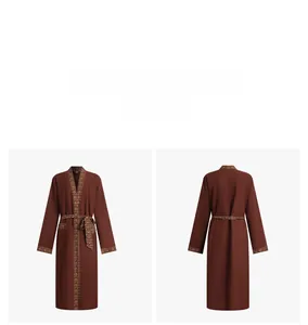 Detail of dark brown bathrobe featuring ethnic pattern ribbon trim on cuffs and waist tie
