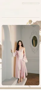 Detailed view of pink satin 3-piece loungewear set featuring feather trim on the sleeves