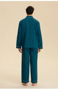 Detail view of the back of men's dark blue loungewear with elegant white piping trim