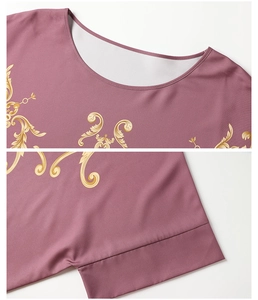Detail of mauve kaftan robe with gold baroque print on neckline and sleeve cuffs