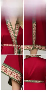 Detail view of red satin robe showing gold baroque embroidery on collar and sleeve cuffs