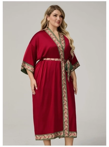 Detailed close-up of dark red satin plus-size bathrobe with elegant vintage floral patterns
