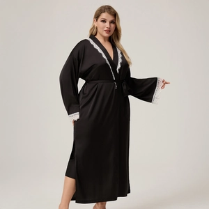 Detail of elegant black satin robe with white lace trim on sleeves and V-neckline