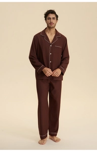 Detail view of men's dark brown cotton pajamas set with white piping and chest pocket