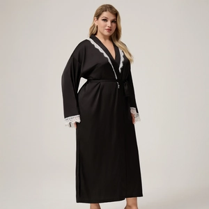 Detail of black satin long robe featuring white lace trim on sleeves and V-neckline