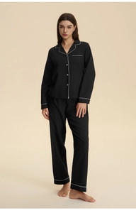 Full view of women's black cloud-cotton pajamas with white contrast piping detail