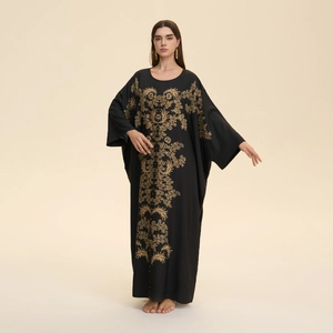 Elegant black kaftan dress for women with intricate gold floral embroidery and batwing sleeves