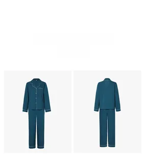 Front and back view of deep cyan pajama set with white piping and chest pocket detail