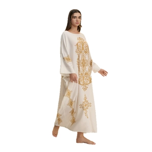 Elegant white kaftan dress with golden baroque scroll pattern and loose wide sleeves