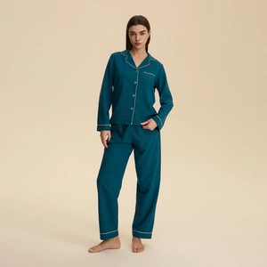 Women's dark cyan pajama set with long sleeves, notched lapels and white piping details