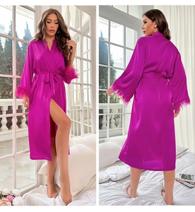 Magenta satin robe featuring luxurious feather trim cuffs and a silk-like belted waist tie