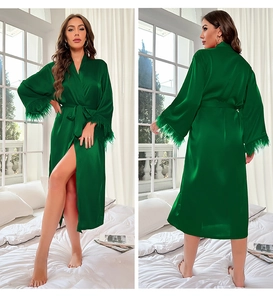Luxurious emerald green silk robe featuring elegant feather cuffs and waist tie closure