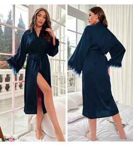 Luxurious navy blue satin robe with ostrich feather trim on sleeves and belted waist details