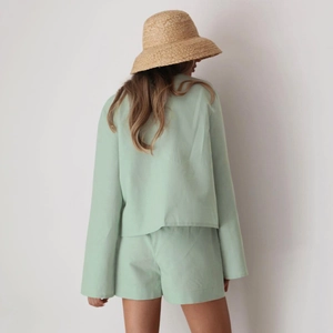 Women's light green cotton lounge set featuring long sleeve top and shorts with back view
