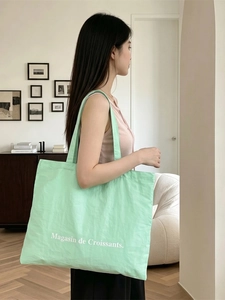 Large mint green canvas tote bag with Magasin de Croissants print for daily school use