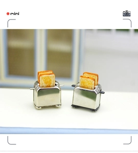 Miniature silver toaster set with detailed toasted bread slices for dollhouse kitchen