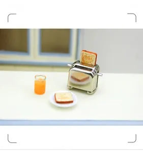 Miniature dollhouse toaster set with toast slices and orange juice for kitchen decor