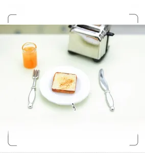Miniature silver bread toaster and tiny toast slices for dollhouse kitchen accessories