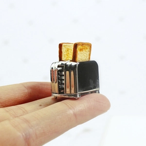 Miniature silver toaster model with toast slices for dollhouse kitchen accessories