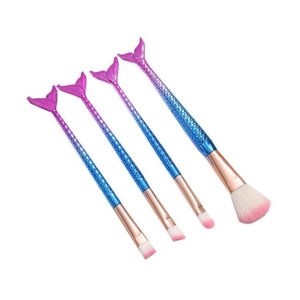 Detail of four gradient mermaid makeup brushes with fish scale texture and pink synthetic hair