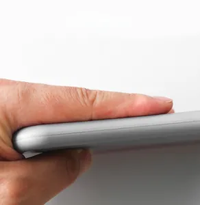 Close-up of the thick grey foam padding being squeezed to show material durability